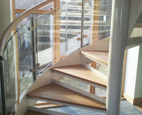 open risers and oak treads on a spiral staircase
