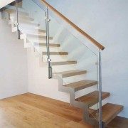 zig zag steel stringers on a stair with oak treads and open risers