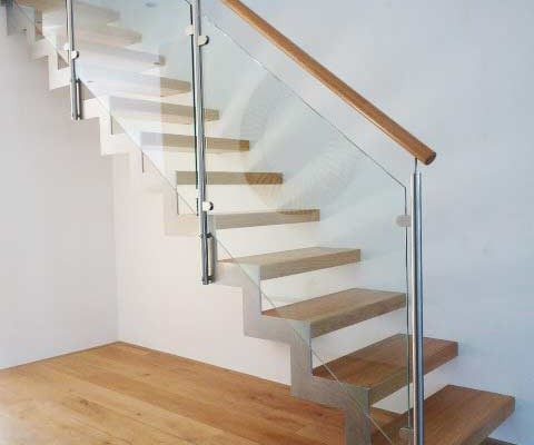 zig zag steel stringers on a stair with oak treads and open risers