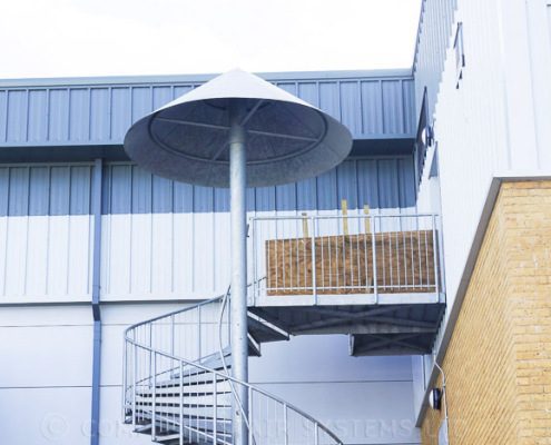 canopy over spiral staircase to back of commercial building
