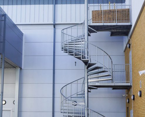 double flight spiral fire escape to rear of commercial building
