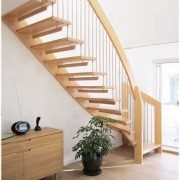 timber floating stair with wooden flooring with sideboard and green plant