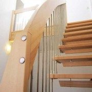 open riser timber staircase with handrail and stainless spindles