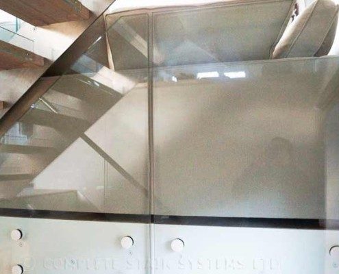 Modern-Staircase-London-4 glass infill panel behind light grey sofa in home