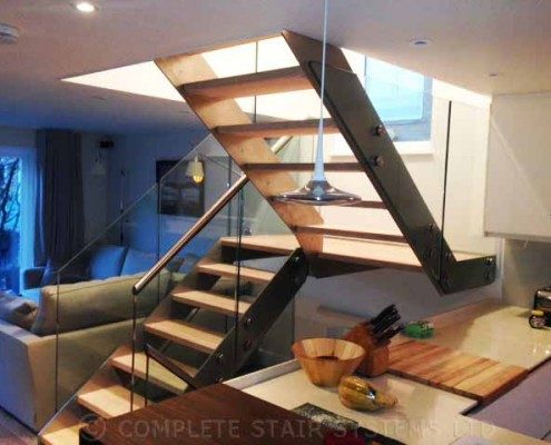 Modern-Staircase-London-7 half turn wood , steel and glass stair with open risers with kitchen in foreground