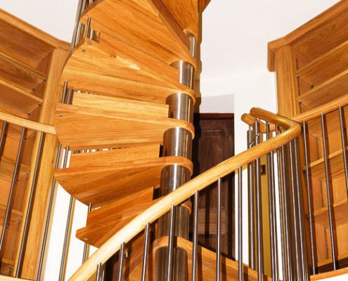 brushed stainless steel spiral staircase with oak steps and handrail