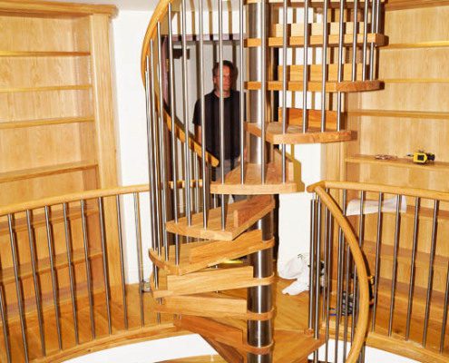 stainless steel and oak spiral stair in a house