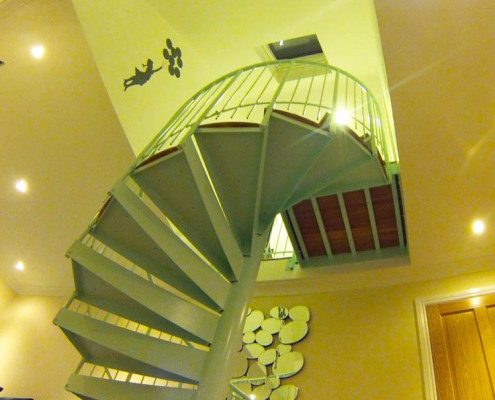 underside of a spiral stair in a home