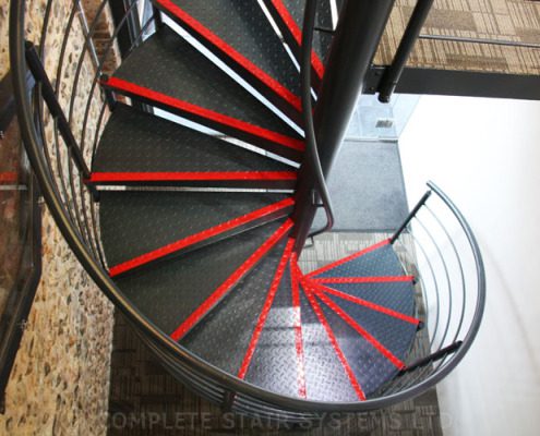 black steel spiral staircase in a commercial setting