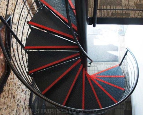 black steel spiral staircase with horizontal steel rails