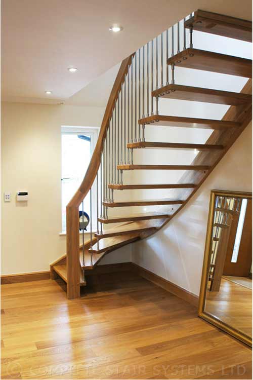 timber floor hallway with floating style timber staircase and window