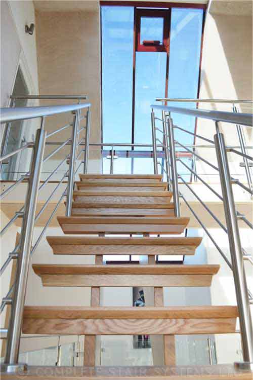 Modern-Timber-Staircase-with open risers with stainless steel balustrade