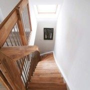 looking down a timber staircase showing landing balustrade