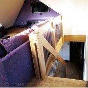 purple sofa with straight flight timber staircase descending