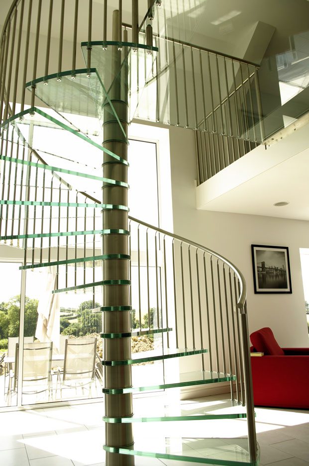 Large glass platform on top of a sprial staircase