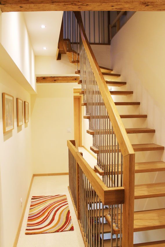 Floating timber stair from landing to upper floor