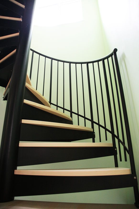 black steel spiral stair with timber steps