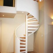 white steel and oak spiral stair with chandelier