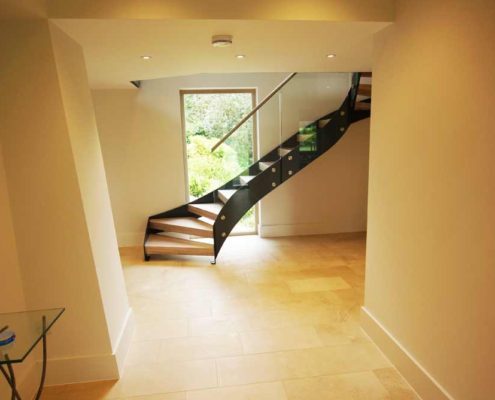 Bespoke-Staircase-Alresford-1 hallway with large black and glass staircase