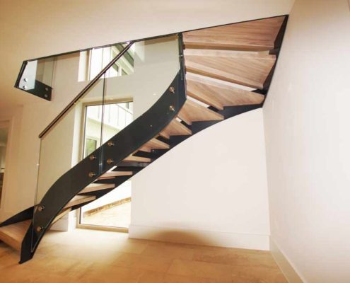 Bespoke-Staircase-Alresford-4 black steel staircase with frameless glass balustrade