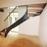 black steel stringer on a staircase with open risers
