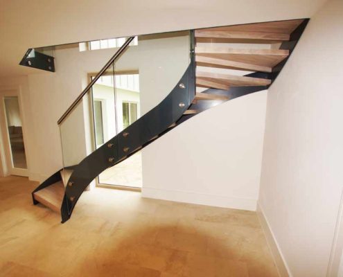 Bespoke-Staircase-Alresford-5 black steel stringer on a staircase with open risers