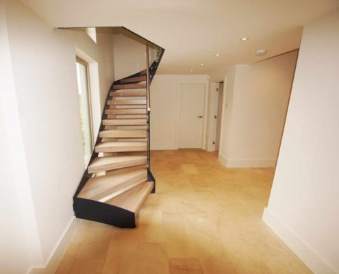 Bespoke-Staircase-Alresford-6 Open riser staircase with wooden steps and black steel stringers