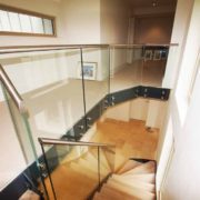 landing area and staircase with black steel fascia