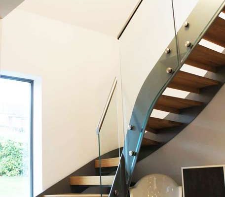 Bespoke-Staircase-Croxley-Green-5 modern steel and glass staircase in front of window
