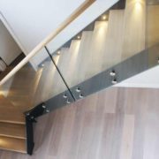 oak steps on a steel stair with glass balustrade