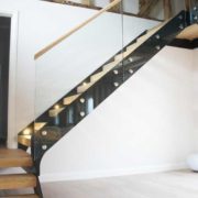 black steel staircase in a oak framed building