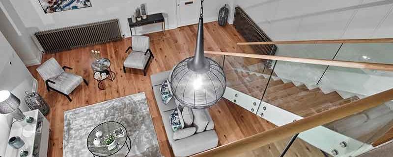 Bespoke-Staircase-Midhurst-1 looking down on a straight flight oak stair with frameless glass balustrade