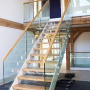 straight flight freestanding staircase in an oak framed building