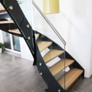 modern black steel staircase with wooden steps and open risers
