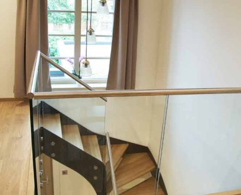 Modern-Staircase-Bromley-4 oak floored landing area with frameless glass balustrade
