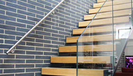 Modern-Staircase-Stamford-3 straight flight open riser oak treads and feature brick wall behind