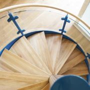 oak spiral staircase with blue outer stringer