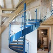 oak framed building with blue spiral staircase