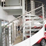 white external stringers and stainless balustrade on a spiral staircase