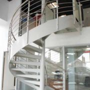 white steel spiral staircase in a commercial setting