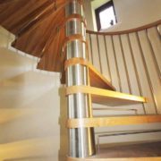 open riser oak spiral staircase with stainless riser bars