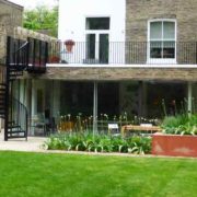 spiral staircase in a garden in black