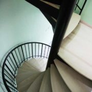 double flight black steel and wood spiral staircase
