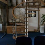 stainless steel centre column on a oak spiral staircase