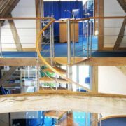 oak framed commercial barn conversion with spiral stair and blue floors