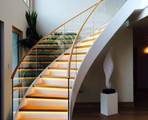 helical staircase with glass panels and oak steps