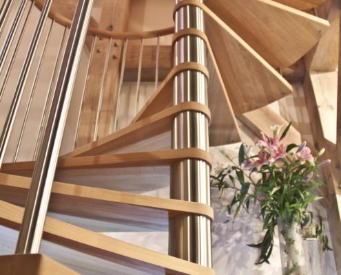 Bespoke Spiral Staircase - Guernsey open wooden spiral stair with stainless steel spindles