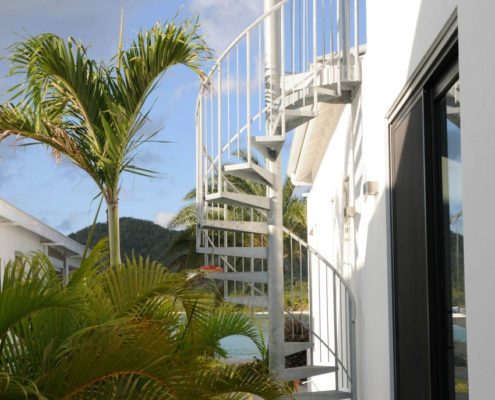 External Staircase Antigua external galvanised spiral stair against a house