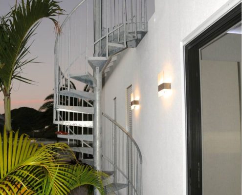 External Staircase Antigua outside spiral stair in galvanised steel with a palm tree