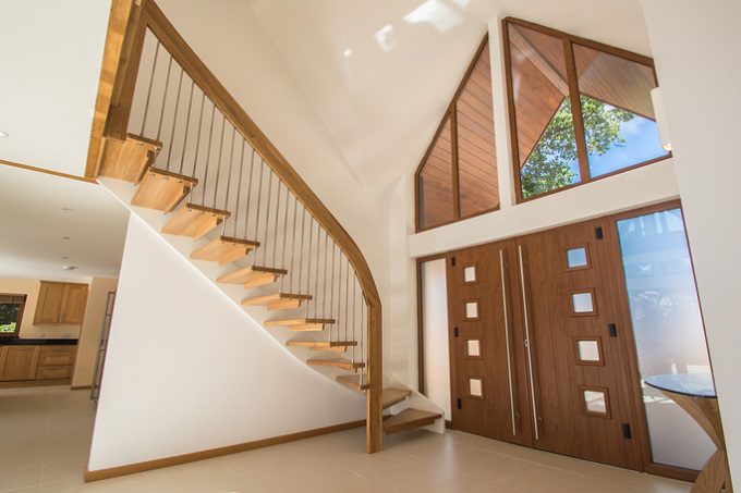 large hallway with floating stair against a wall